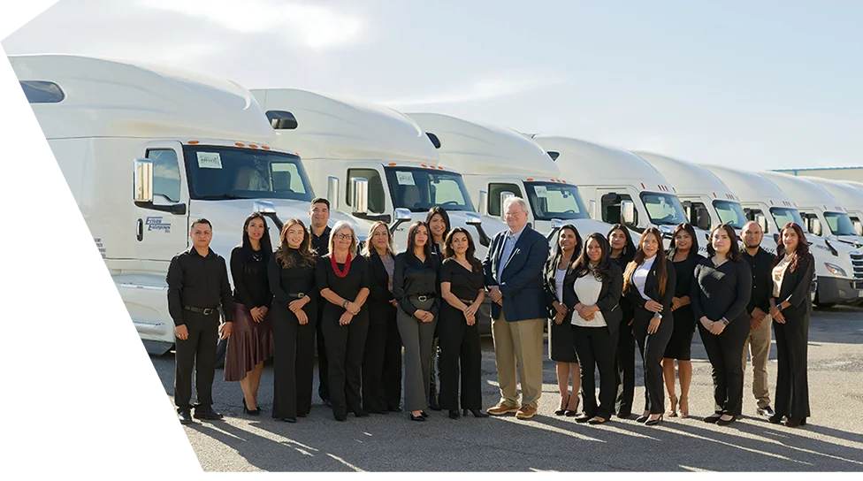 el paso transportation team photo next to truck fleet